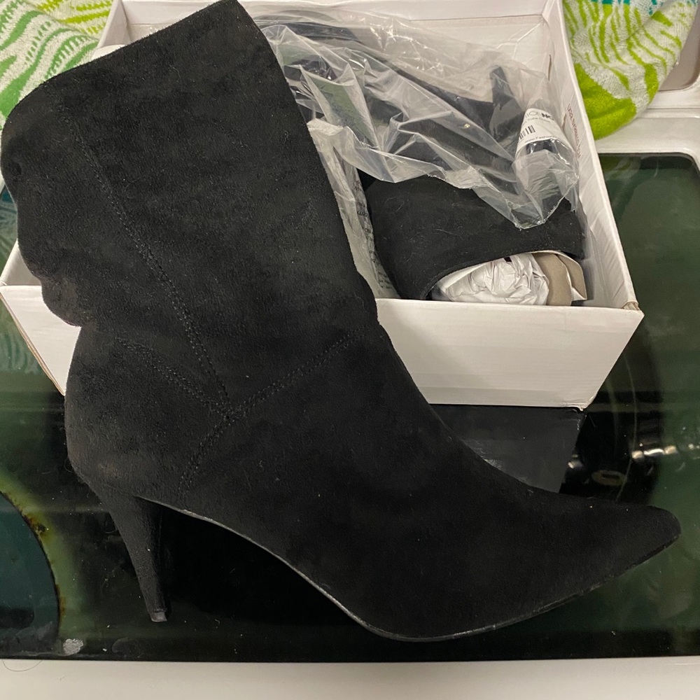 Black suede ankle boot with back silver button.